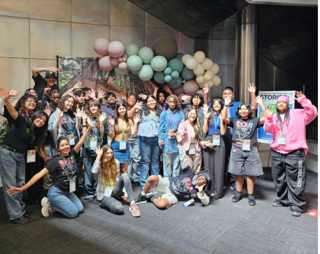 2025 Student Advisory Board, Cohort 3 members are standing and grouped together, smiling, in front of a balloon arch.