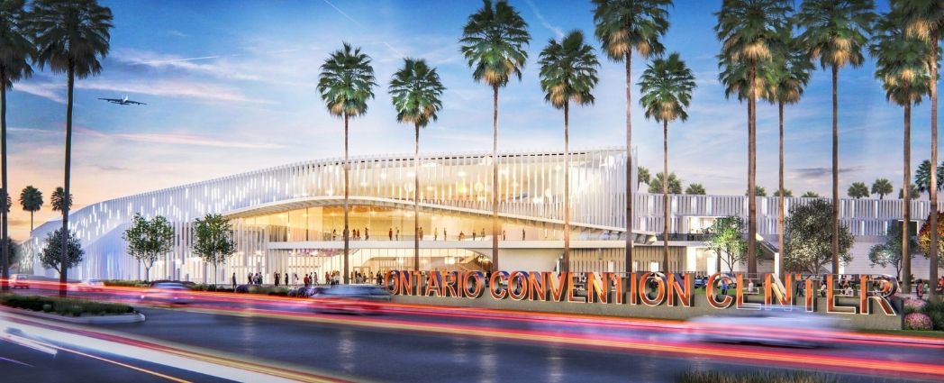 Looking up at an empowering image of trees. The trees are very tall redwood trees that are reaching towards the sun. The image conveys the emotions of strength, growth, optimism, and empowerment.